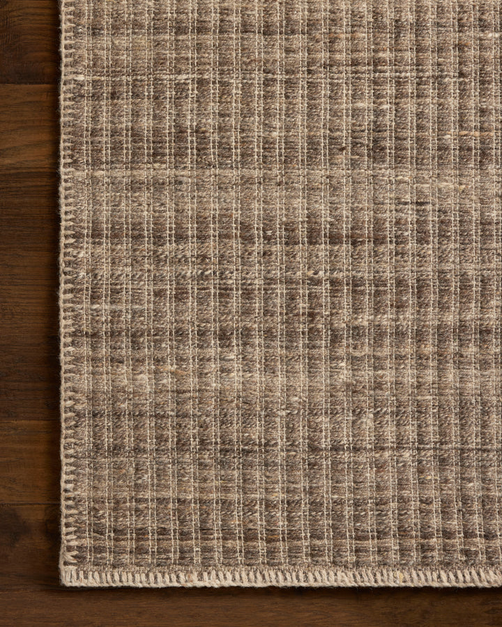 Textured Elm Bark coloured area rug on a wooden floor