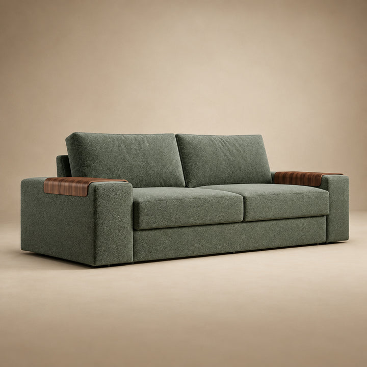 Vilander Sofa Bed with Wide Arms in 281 Boreal Green textured upholstery, featuring walnut wood armrest accents and a modern design, shown against a warm beige studio background.