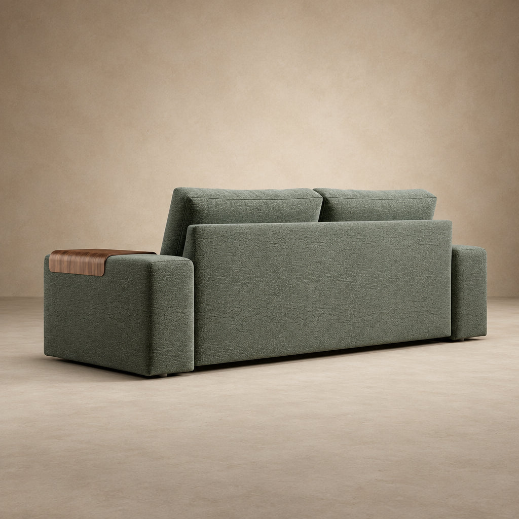 Vilander Sofa Bed with Wide Arms in 281 Boreal Green textured upholstery, featuring walnut wood armrest accents and a modern design, shown against a warm beige studio background.