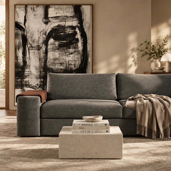 Vilander Sofa Bed with Wide Arms in 282 Warm Grey textured upholstery, featuring walnut wood armrest accents and a modern design, shown against a warm beige studio background.
