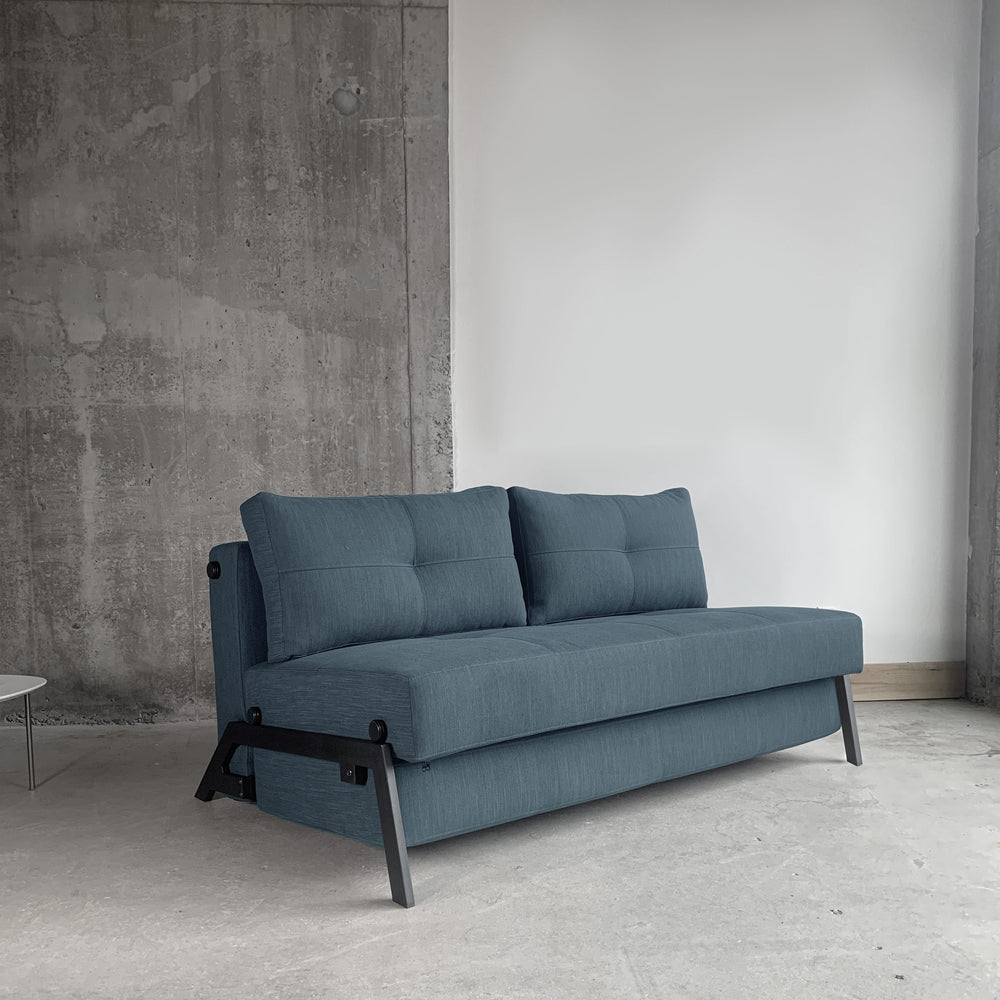 Stretch sofa bed with black legs